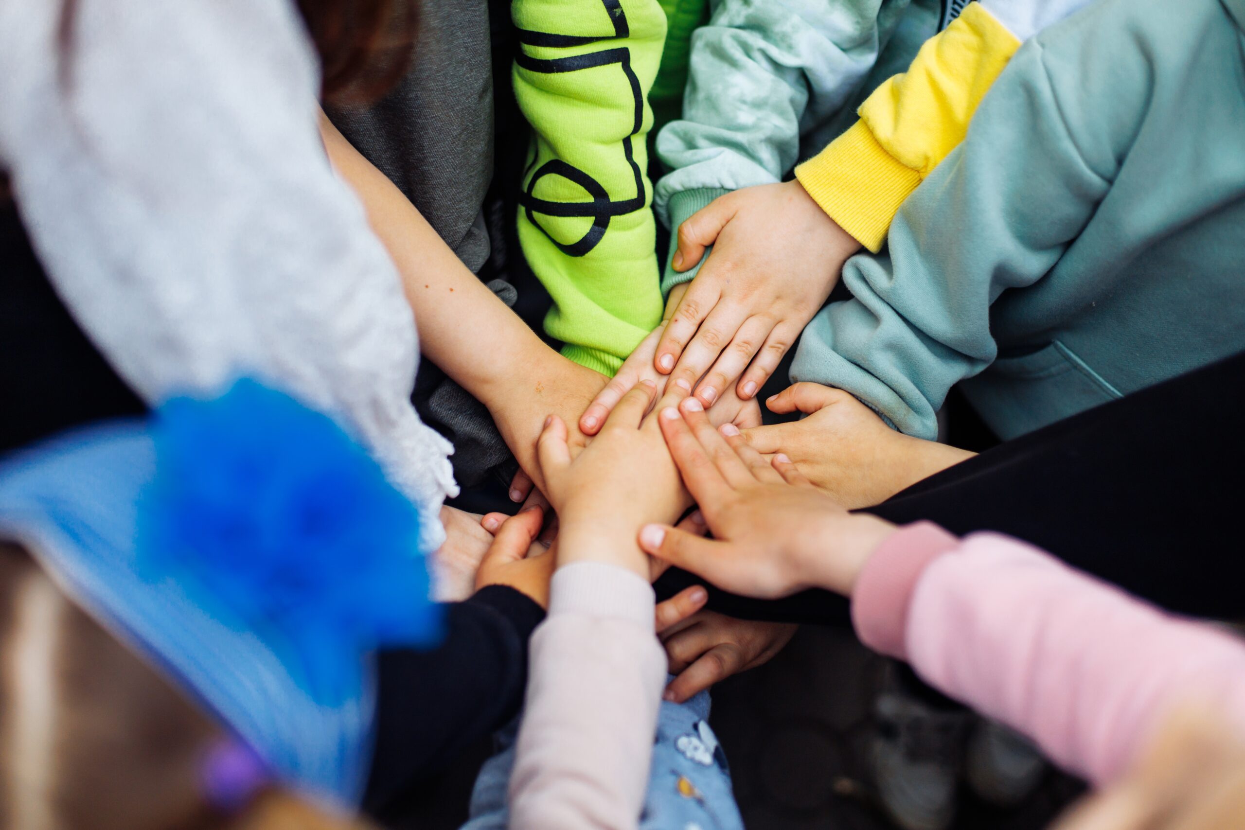 Children's hands, team building and friendship